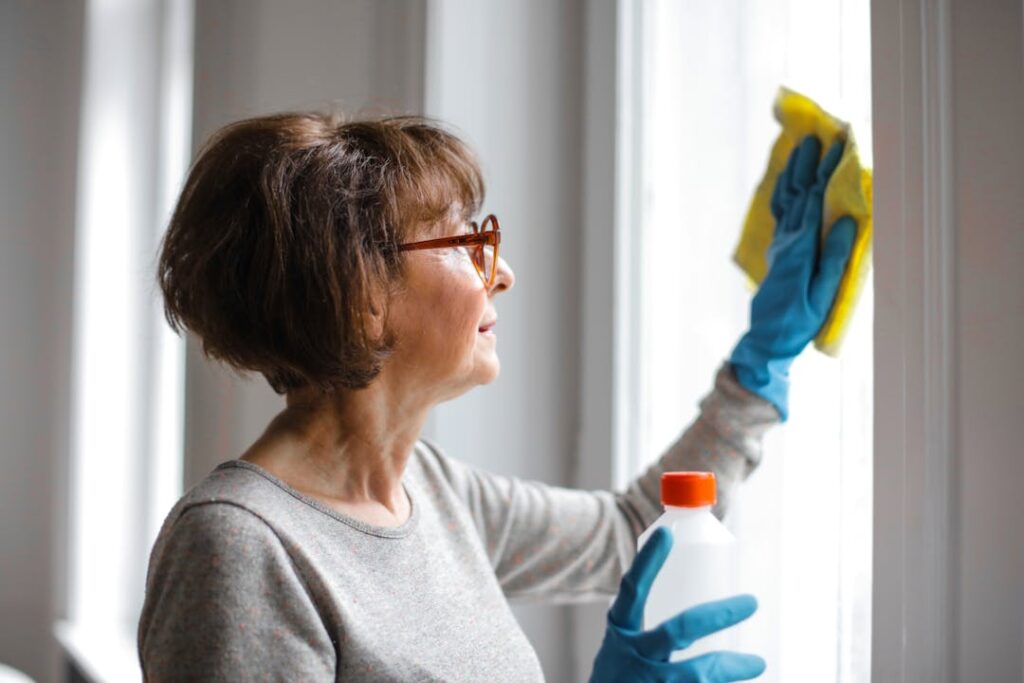 A woman cleaning a window