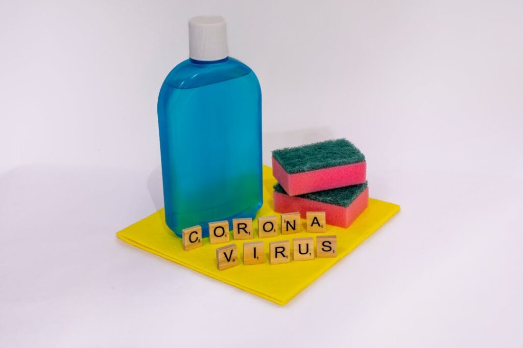 A cleaning solution in a spray bottle and sponges